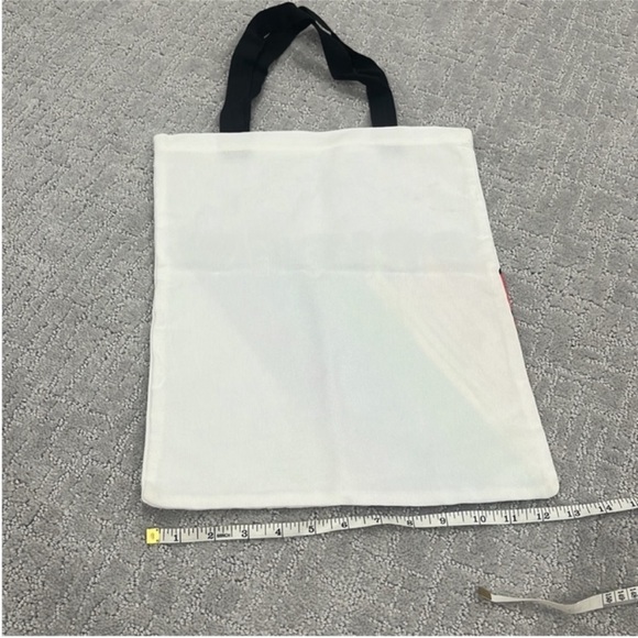 NWOT Stylish tote bag with a vibrant rainbow design and 'Pride' text. - Picture 2 of 2